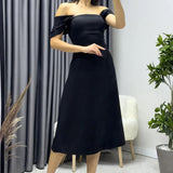 فستان أسود متوسط ​​الطول